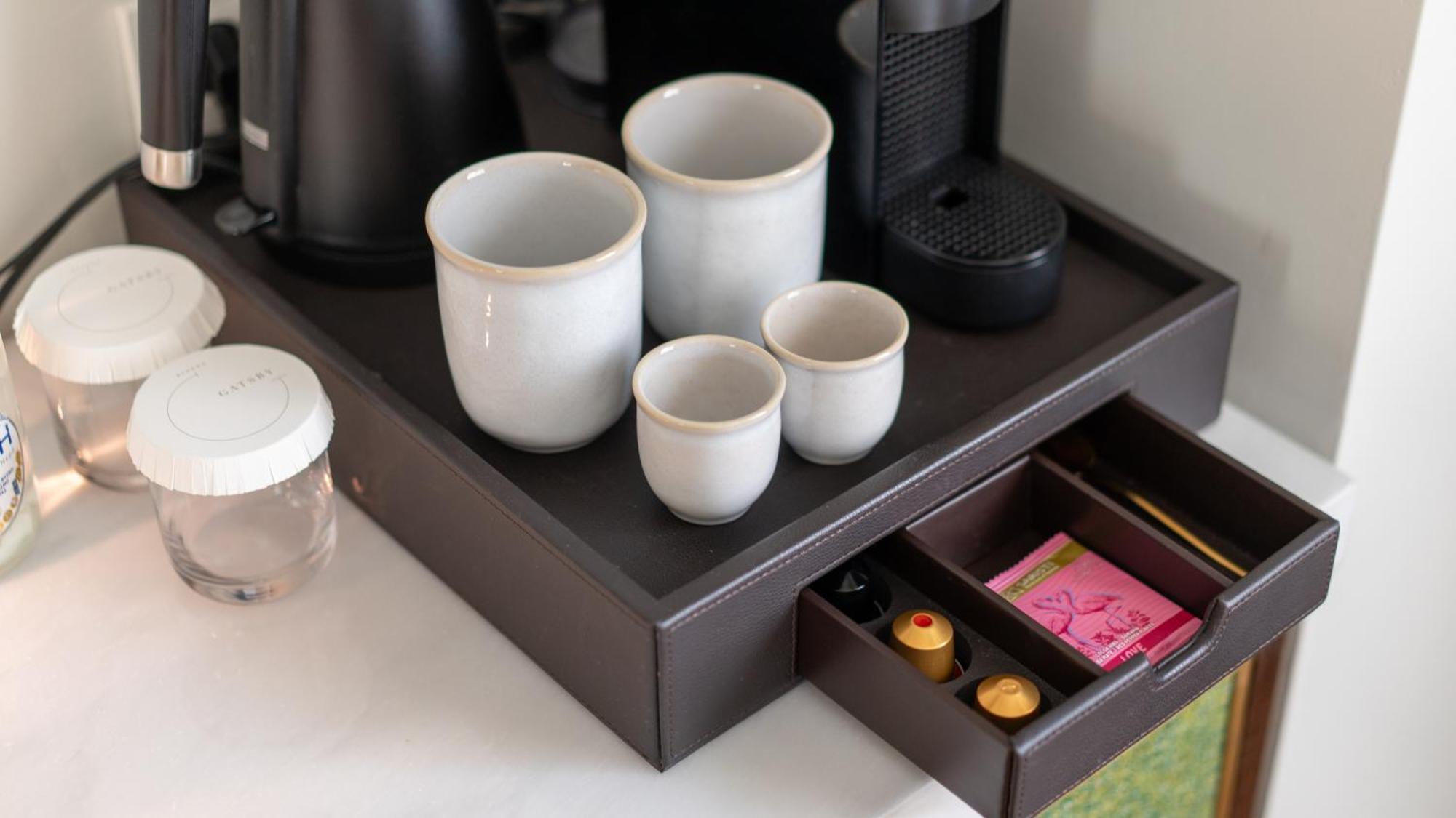 Gatsby Athens Hotel Bagian luar foto A Nespresso machine in a hotel room